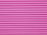 Horizontal pink blinds or slats cover the entire frame, creating a pattern of alternating light and shadow.