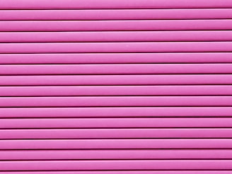 Horizontal pink blinds or slats cover the entire frame, creating a pattern of alternating light and shadow.