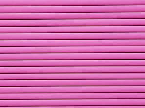Horizontal pink blinds or slats cover the entire frame, creating a pattern of alternating light and shadow.
