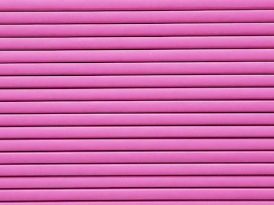 Horizontal pink blinds or slats cover the entire frame, creating a pattern of alternating light and shadow.