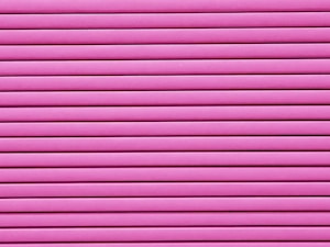 Horizontal pink blinds or slats cover the entire frame, creating a pattern of alternating light and shadow.