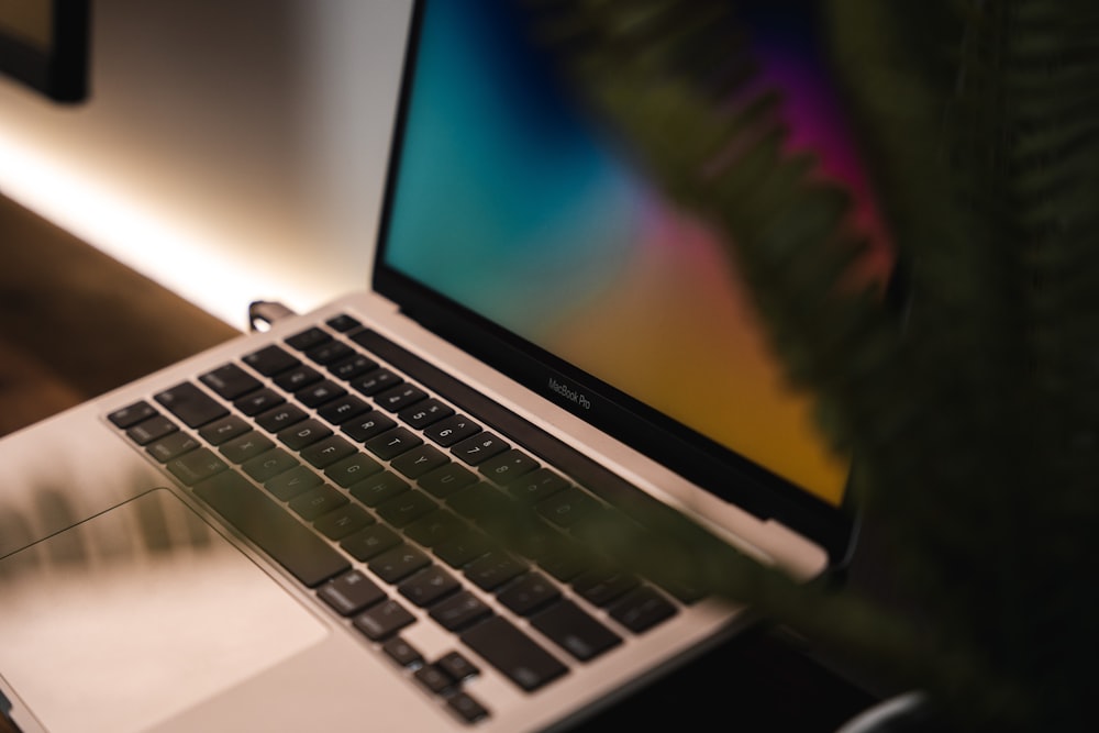 a laptop computer sitting on top of a desk