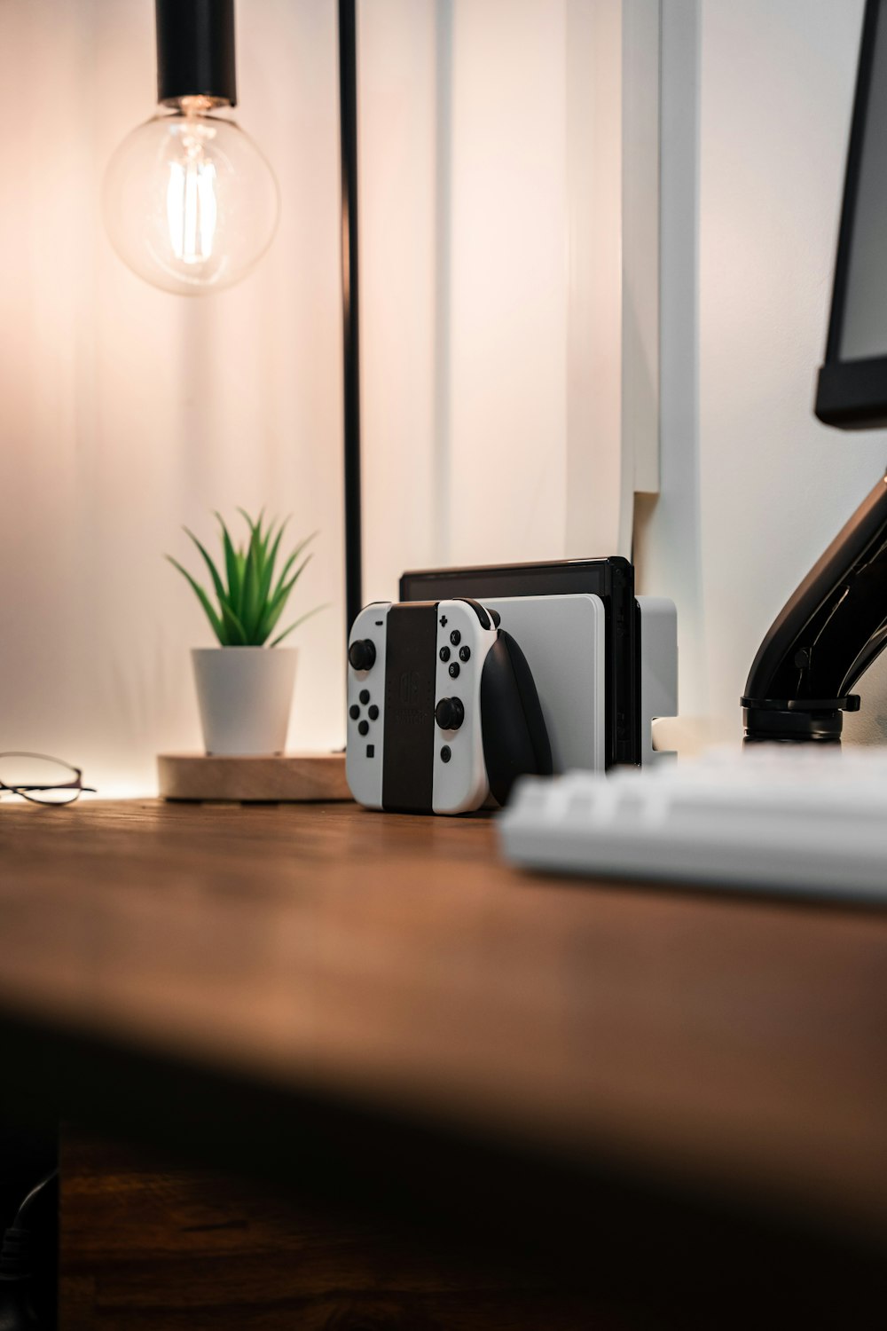 a desk with a keyboard, mouse and a monitor