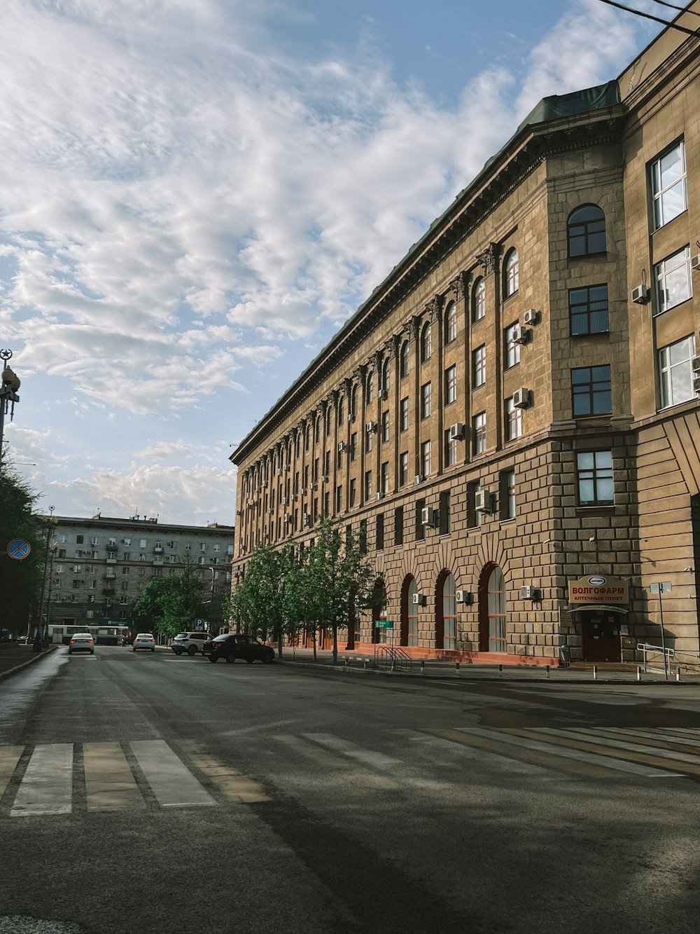 a large brown building sitting on the side of a road