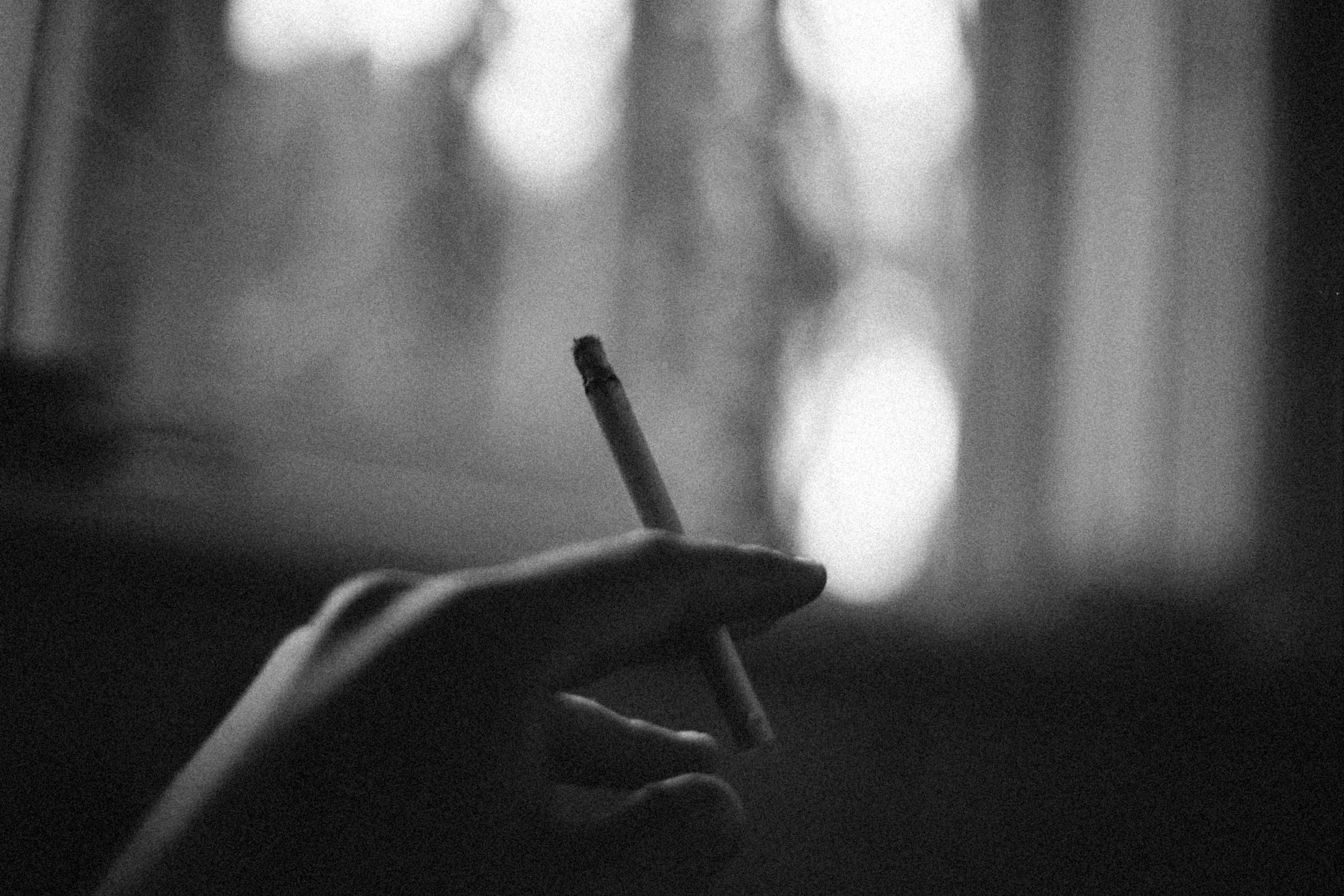 someone holding a cigarette The Truth About Smoking Pleasure and Nicotine Addiction What's wrong with a cigarette?