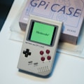 a nintendo gameboy sitting on top of a table
