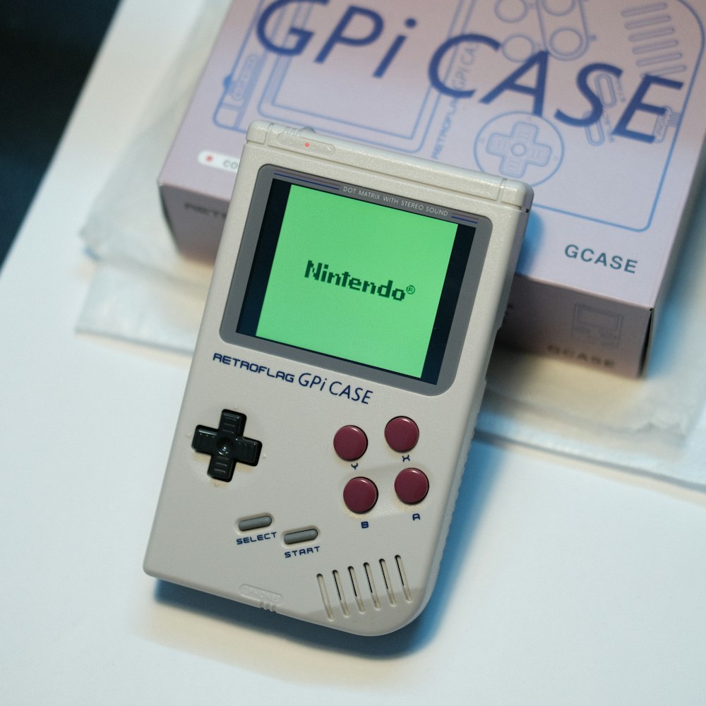 a nintendo gameboy sitting on top of a table