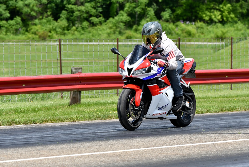 a person riding a motorcycle on a race track