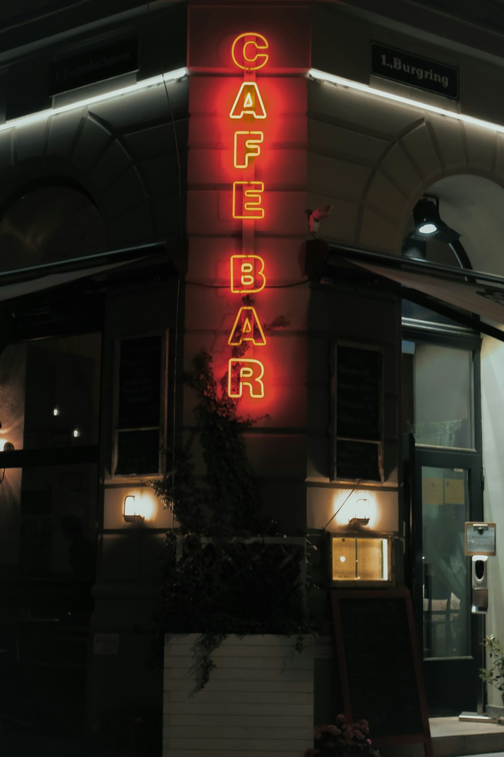 a building with a neon sign on the side of it