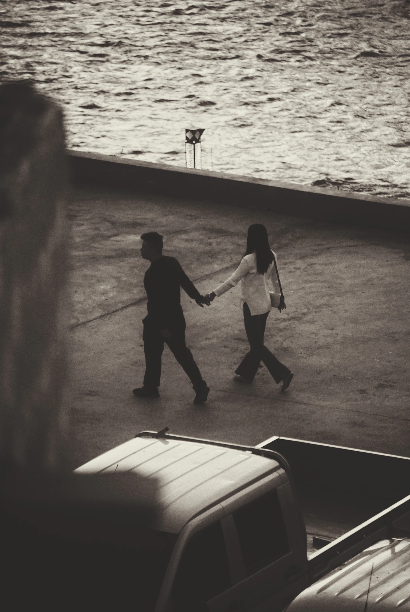 A couple walking hand in hand