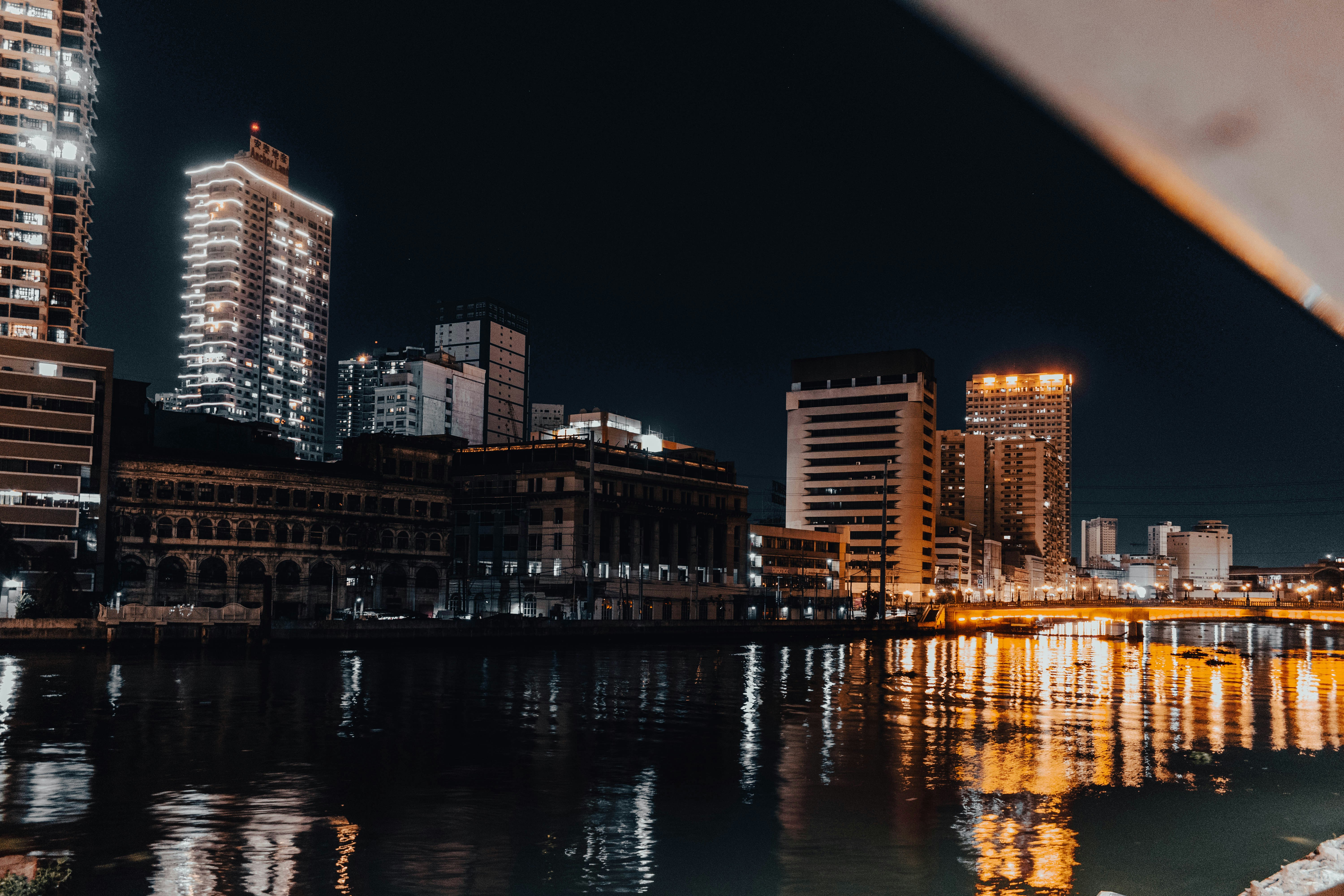 a view of a city at night from across a river