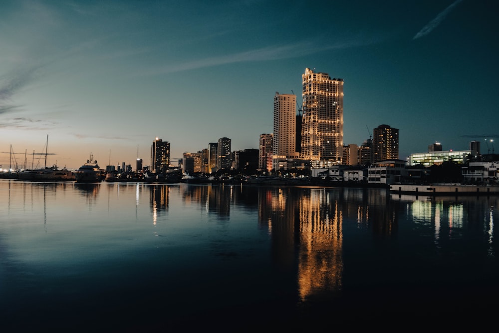 a large body of water with a city in the background