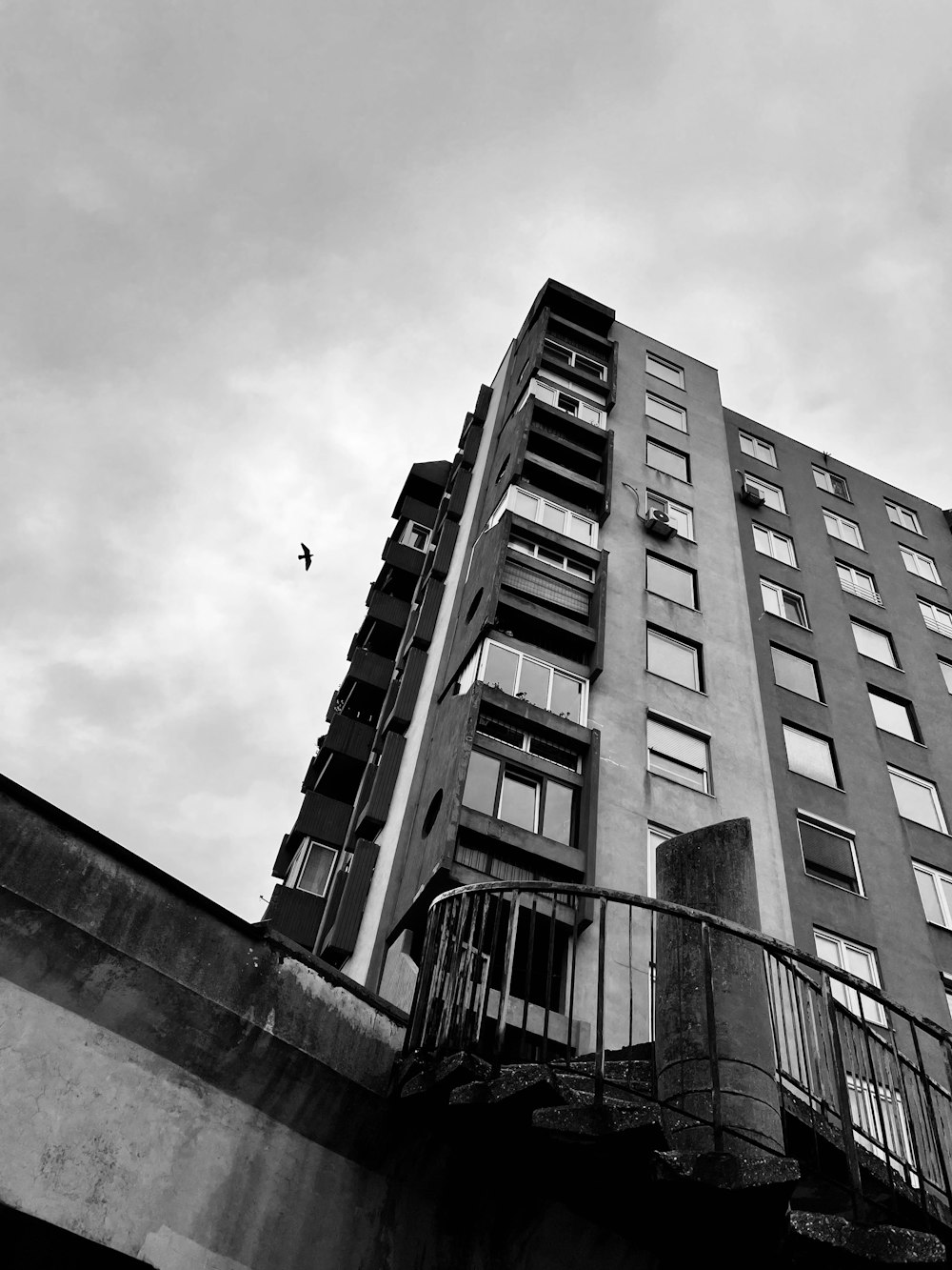 a black and white photo of a tall building