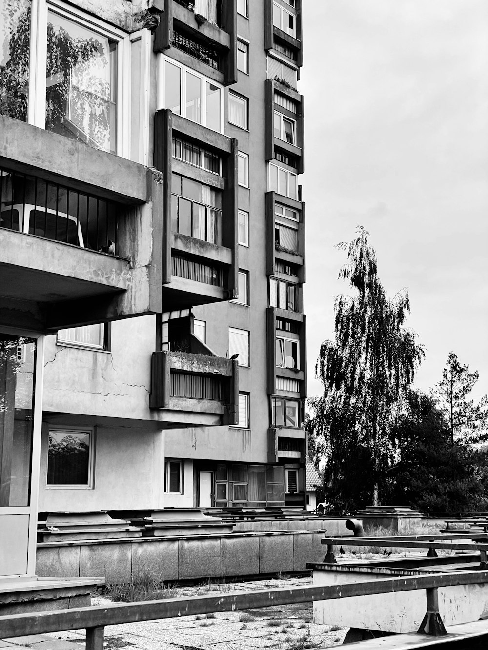 a black and white photo of a very tall building