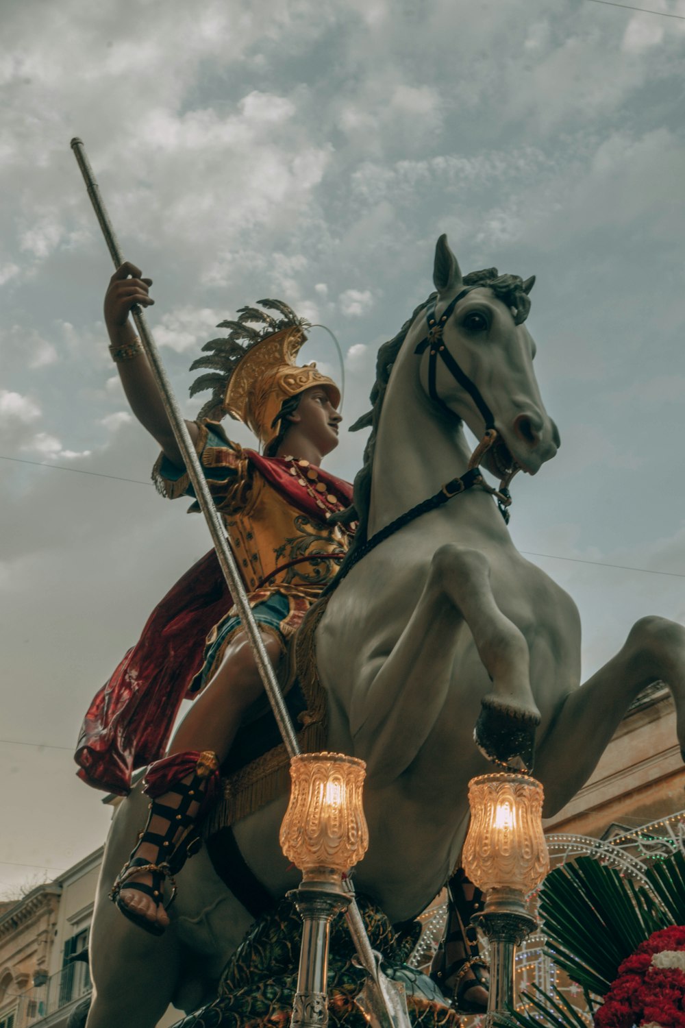 a man riding on the back of a white horse