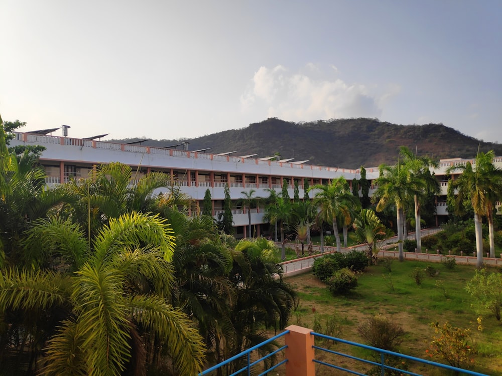 a view of a building with a mountain in the background