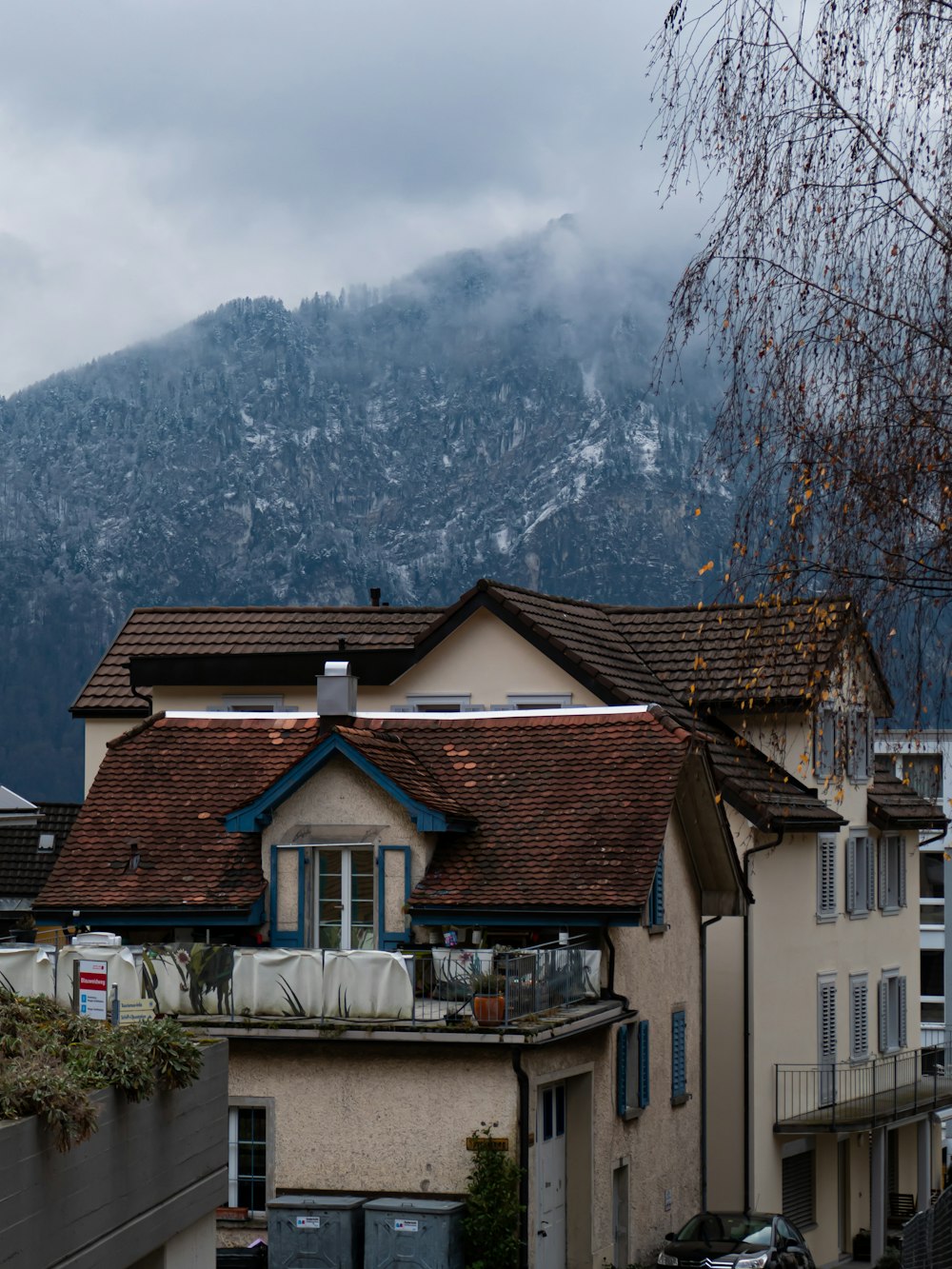 a house with a mountain in the background