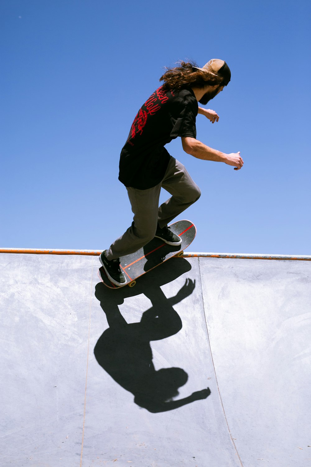 a man riding a skateboard up the side of a ramp