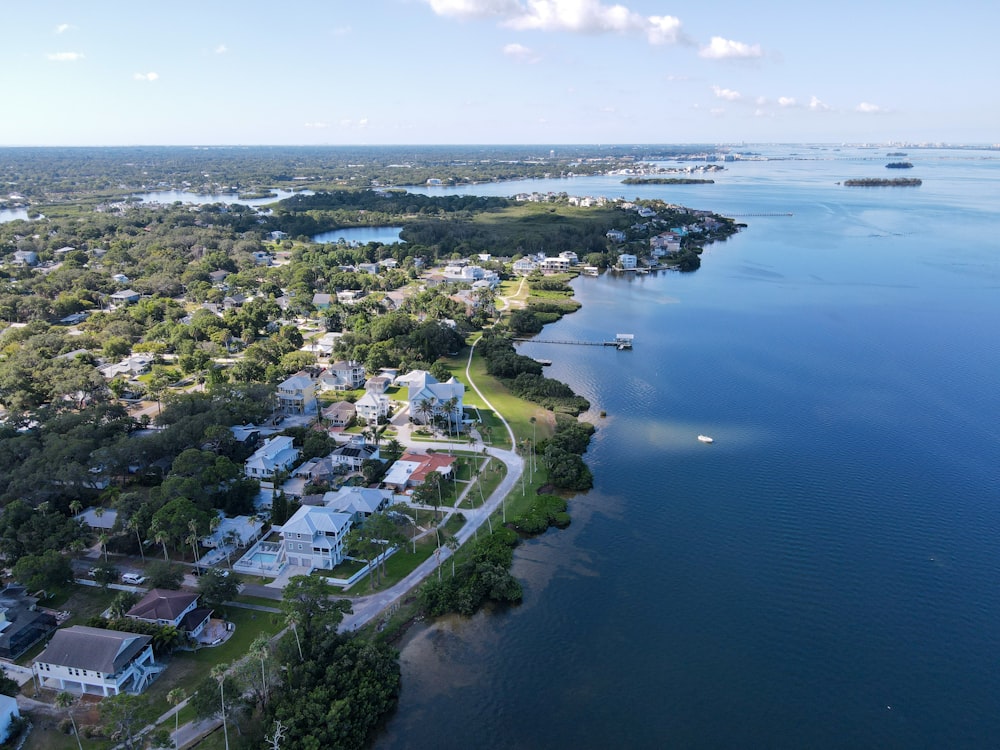 an aerial view of a small town by the water