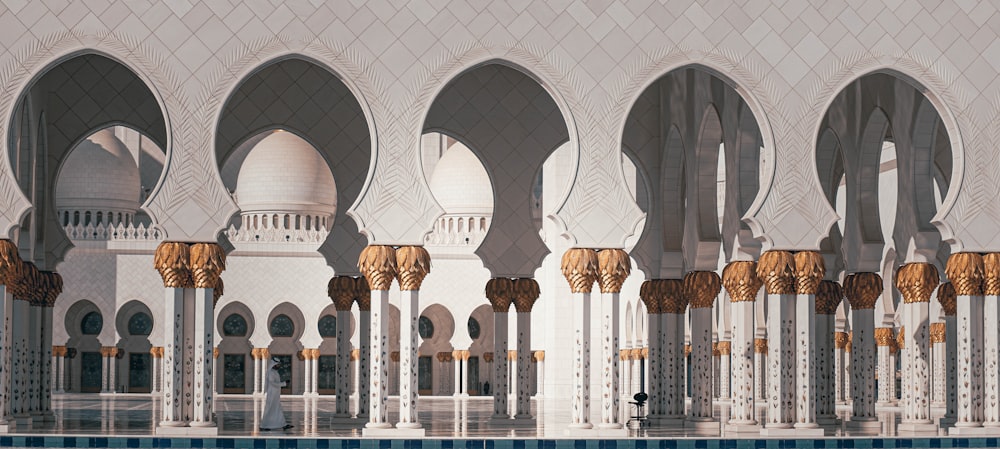 a large white building with arches and pillars