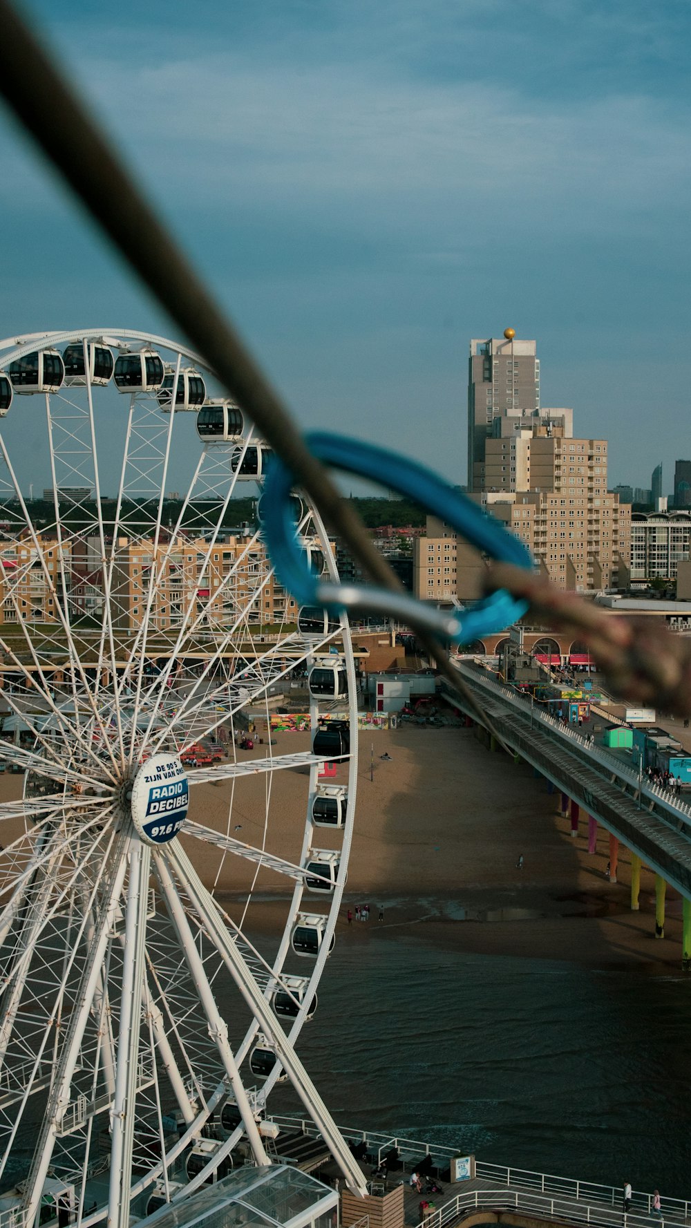 a ferris wheel in front of a city skyline