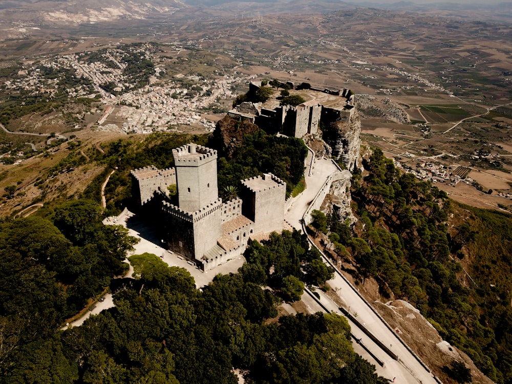 an aerial view of a castle on a hill