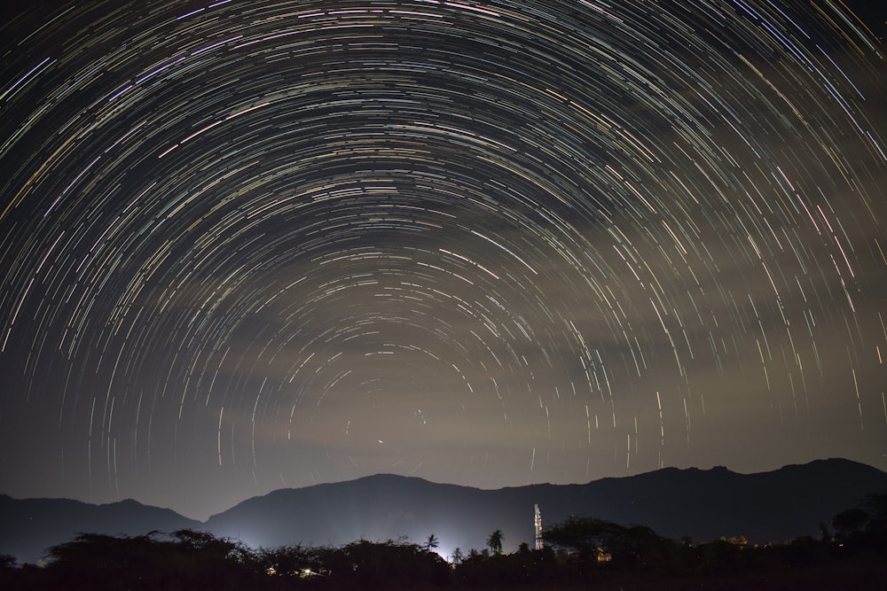 a star trail is seen in the night sky