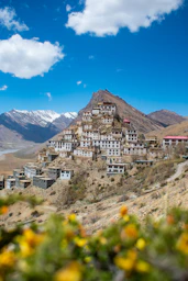 a very tall building sitting on top of a hill