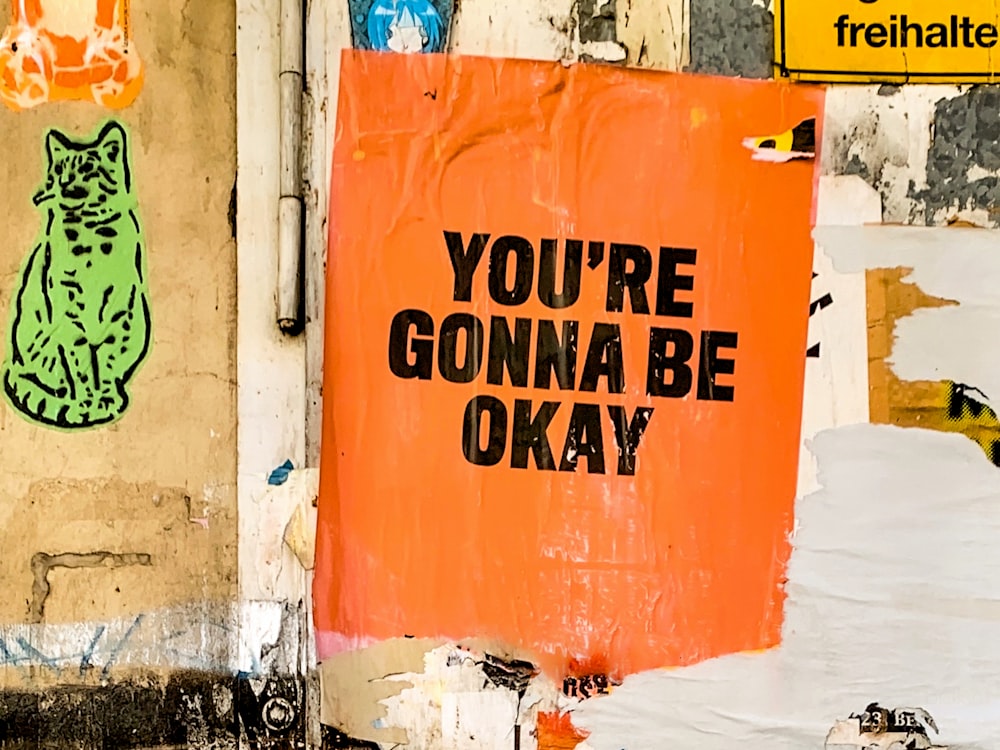 a sign on a wall that says you're gon na be okay