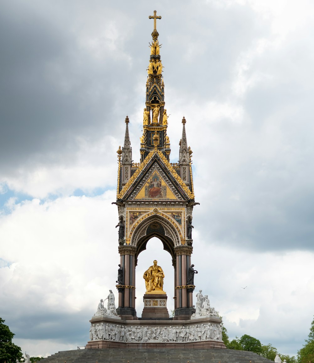 a tall tower with a cross on top of it