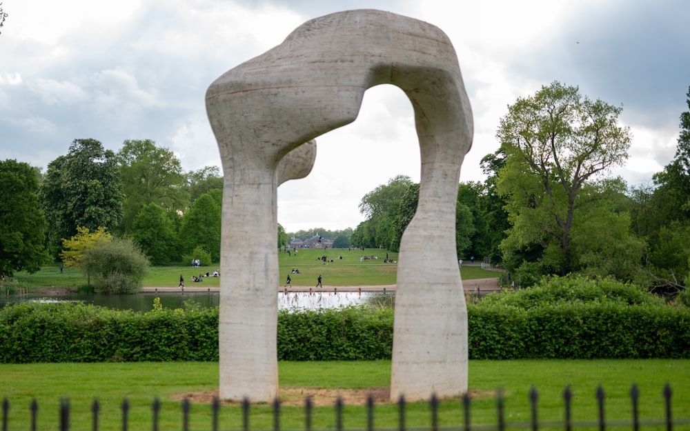 a sculpture in the middle of a park