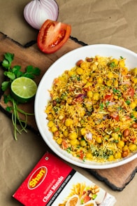 a white bowl filled with food on top of a wooden cutting board
