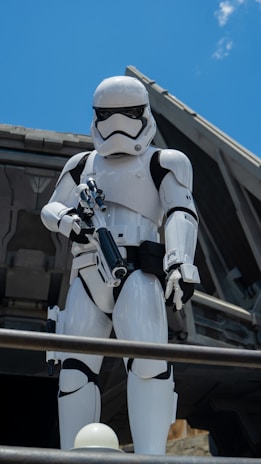 Illustration of a futuristic Christian soldier in sci-fi armor standing guard under a cross-shaped constellation.