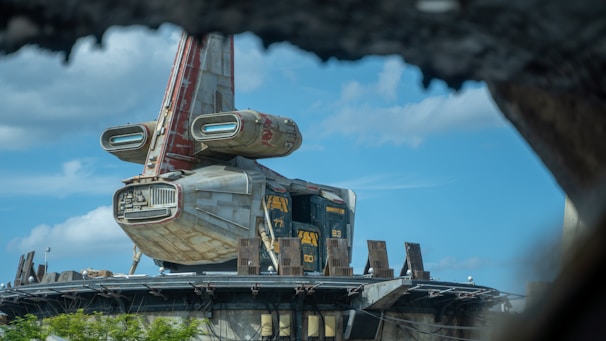 a futuristic looking building with a crane on top of it