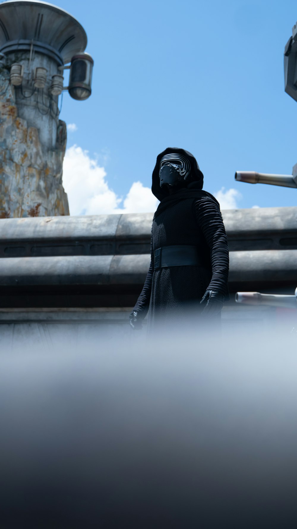 a person in a star wars outfit standing on a roof
