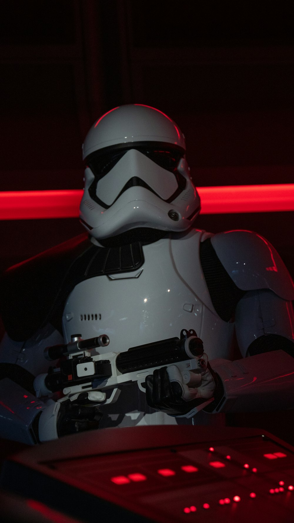 a storm trooper is sitting in front of a laptop