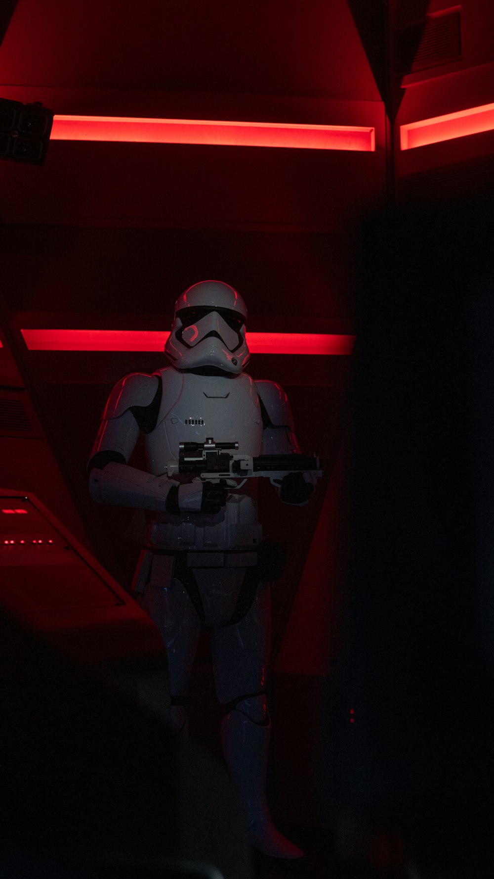 a man in a star wars costume holding a gun