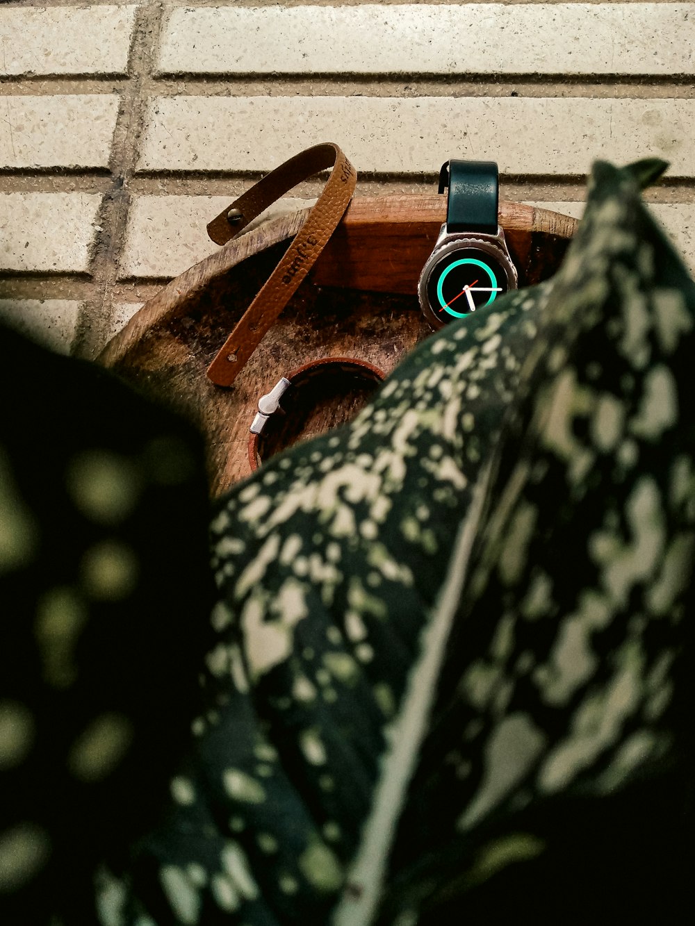 a watch sitting on top of a wooden box