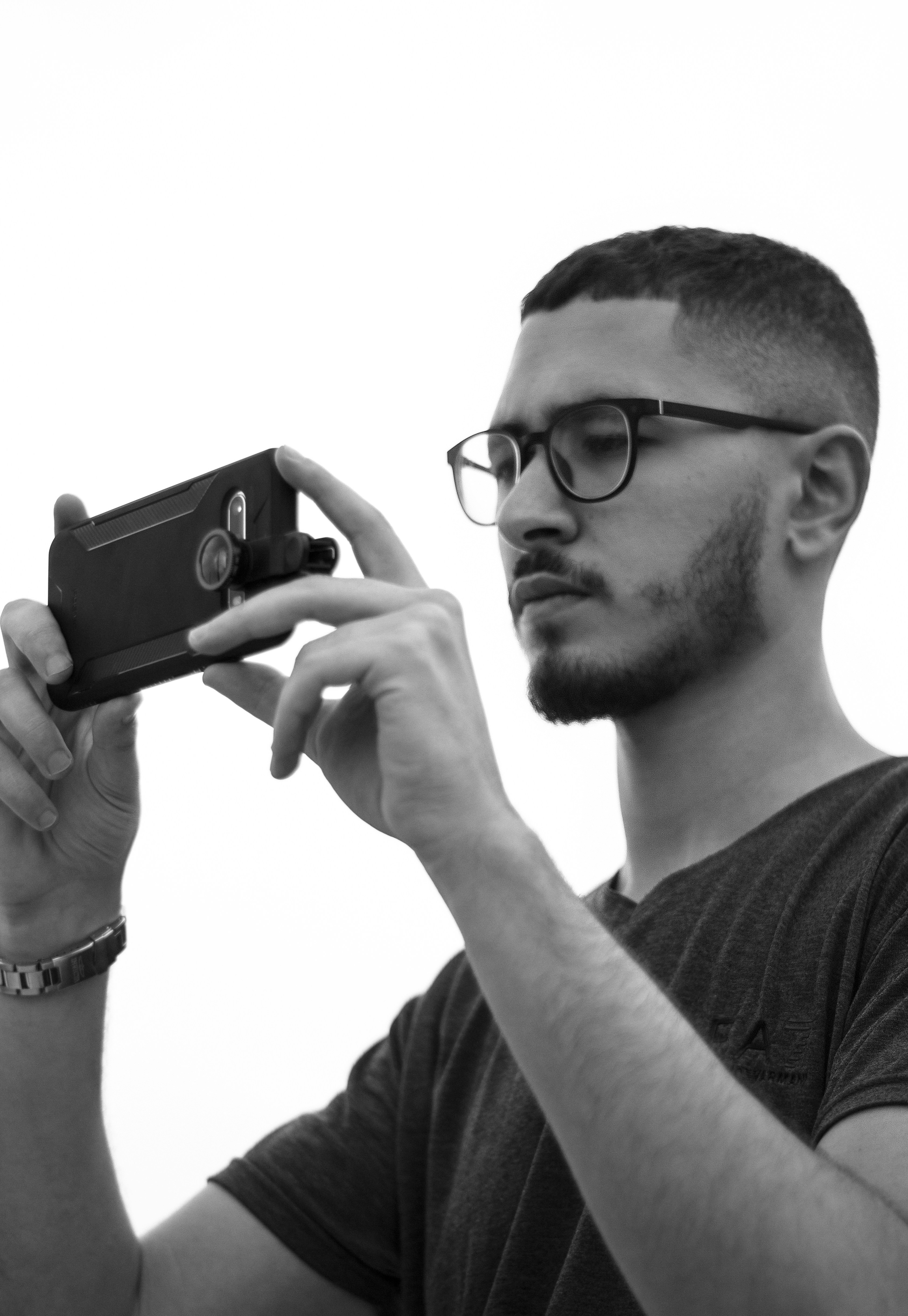 a man holding a camera up to take a picture