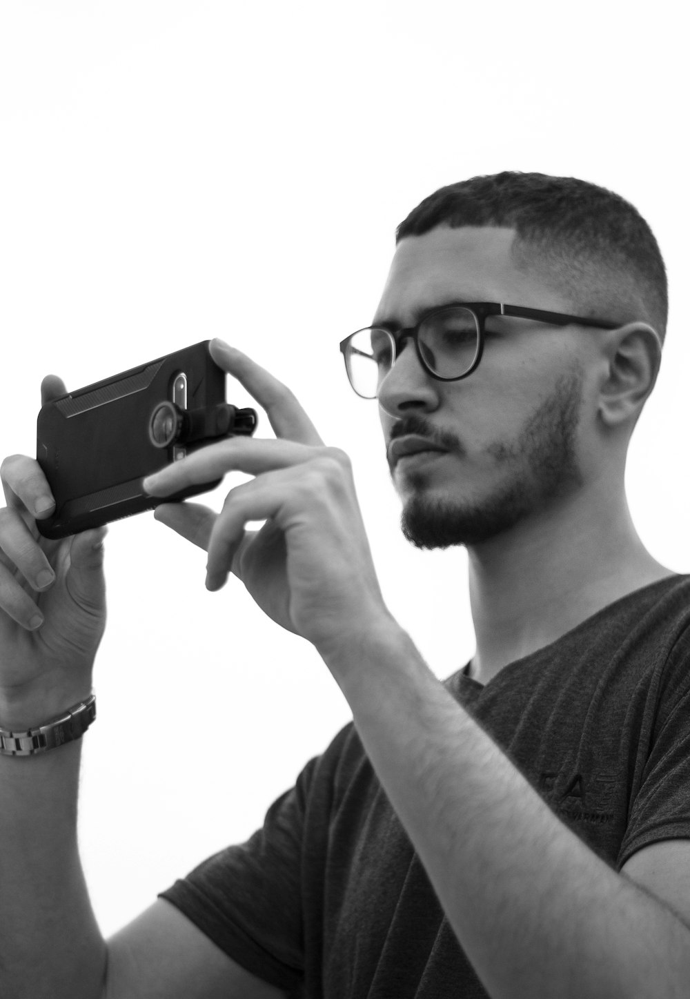 a man holding a camera up to take a picture