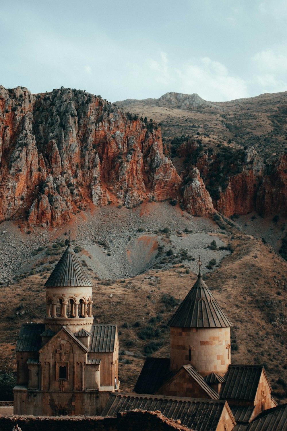 an old church in the middle of a mountain range