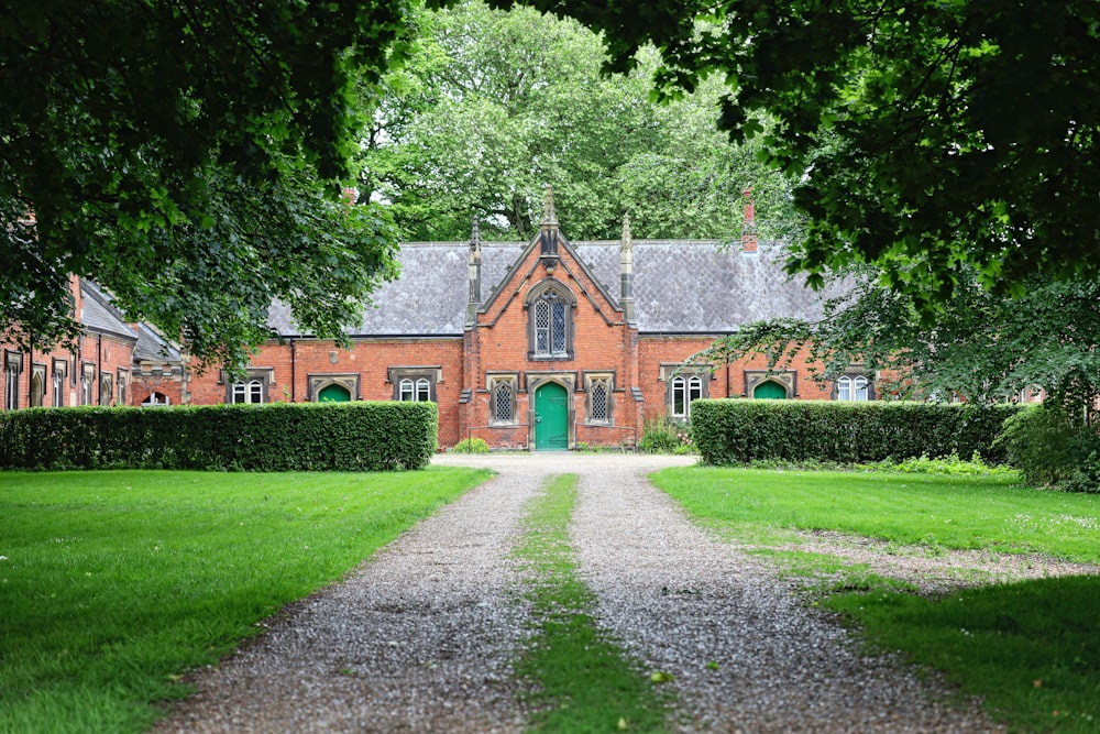 a large brick house with a green door