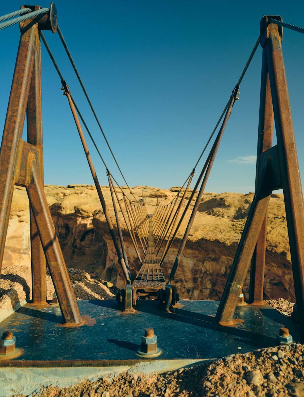 a very large bridge over some water in the desert