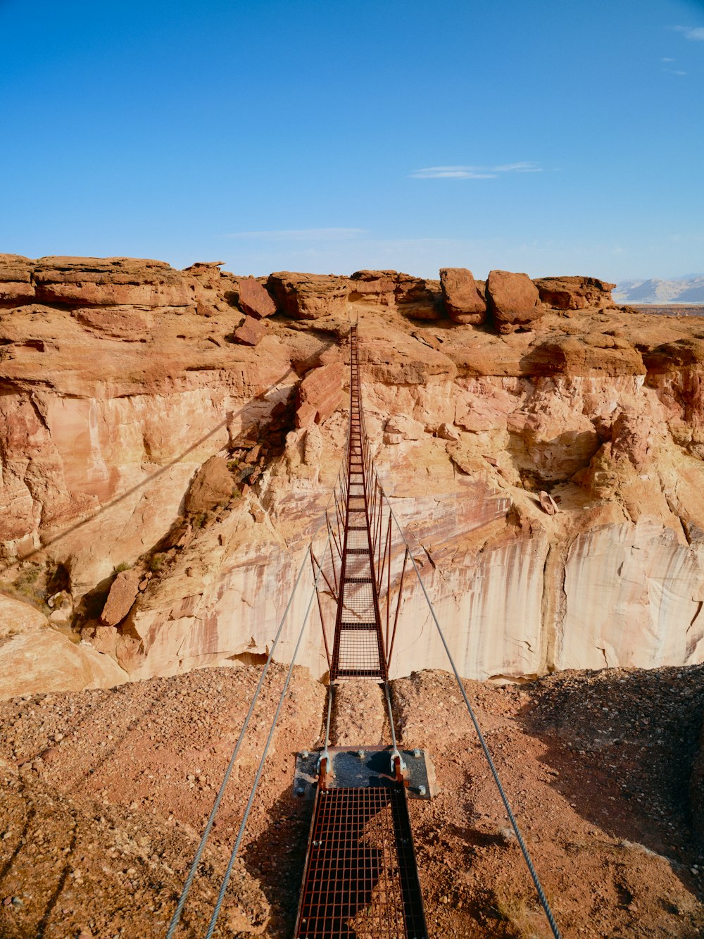 a train track going through a canyon in the desert