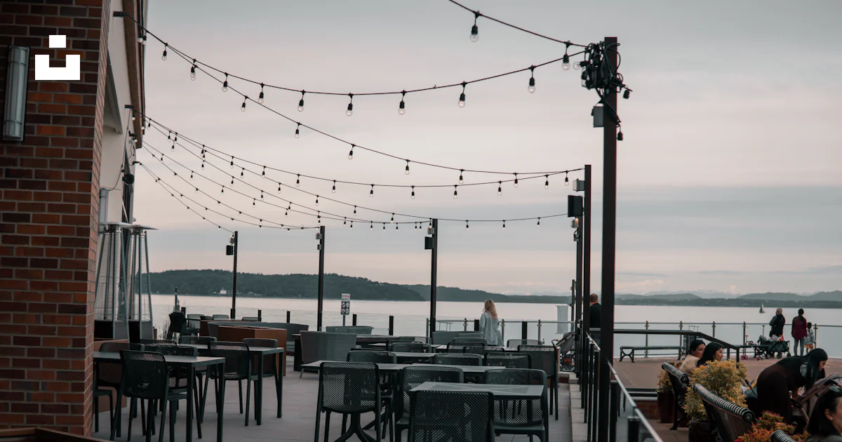 Dinner Point Ruston A restaurant with tables and chairs overlooking a body of water photo ...