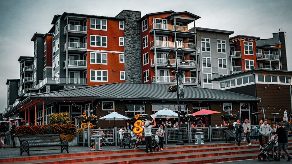 a group of people standing outside of a building