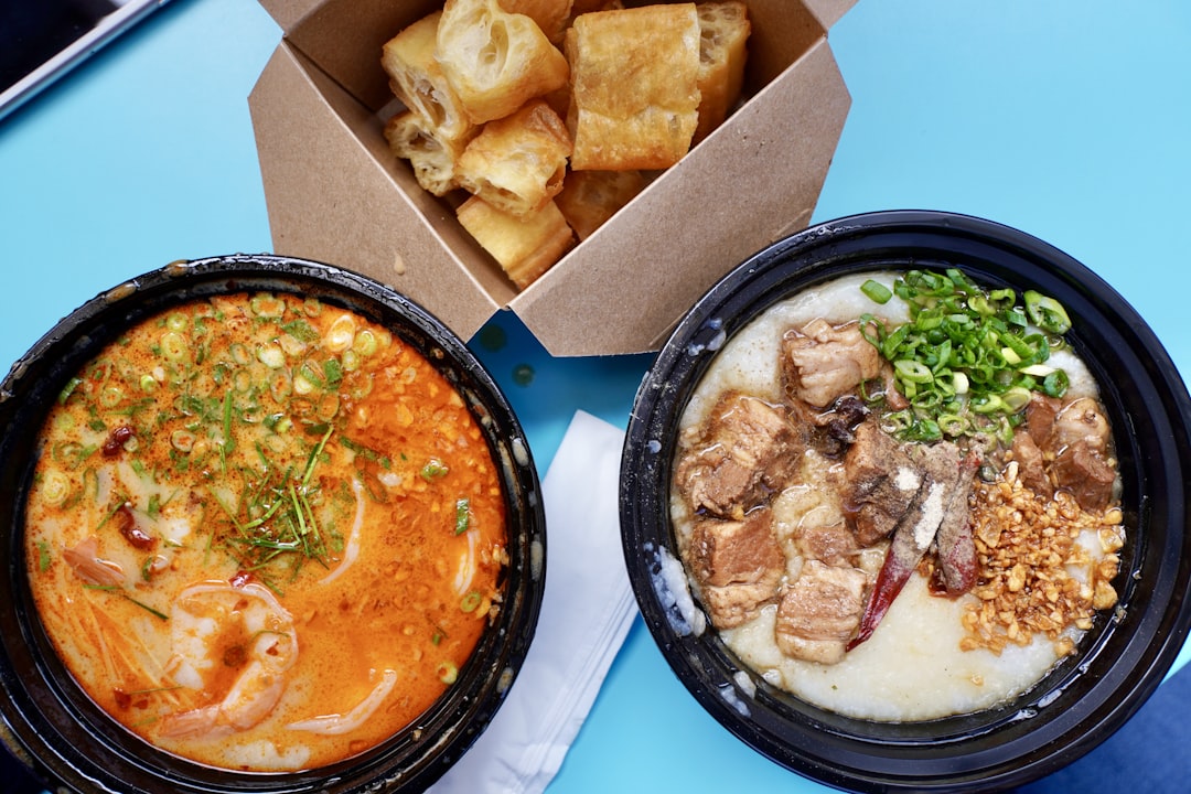 a couple of bowls of food on a table,