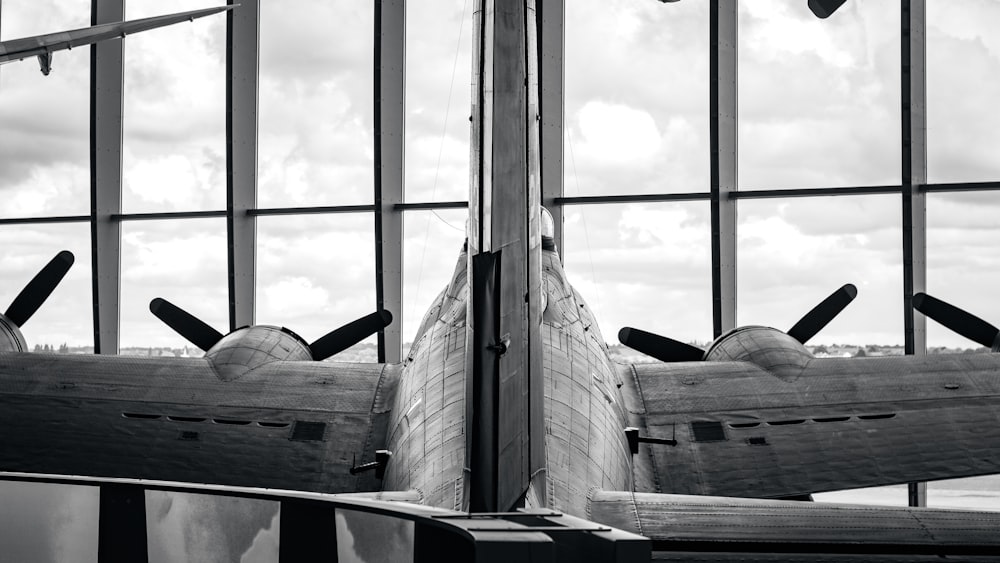 a plane is sitting in front of a window