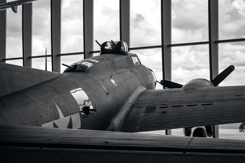 an old airplane is parked in a hangar
