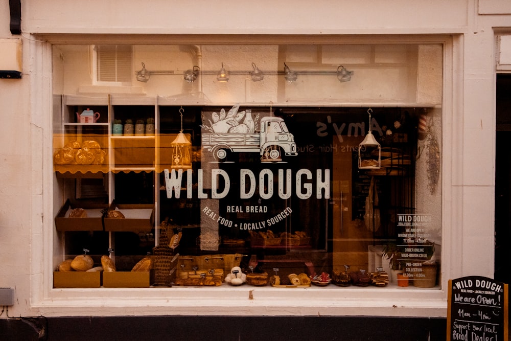 a store window with a sign that says wild dough